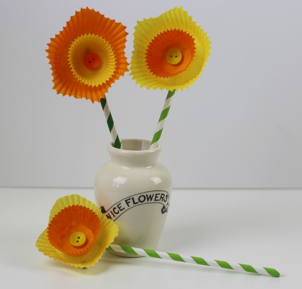 3 Daffodils made from yellow and orange cake cases with a button in the center