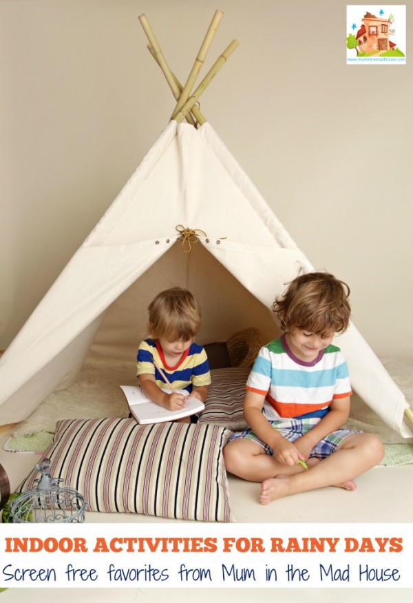 Child playing at home indoors with a teepee tent