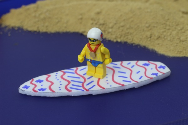 Minifigure on surfboard