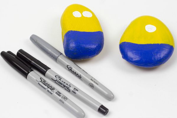 Stone Minions. Join in with the Minion Madness by making these Minions from stones or rocks with your children. This is a super simple kids craft activity.
