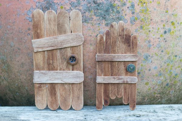 How to make craft stick fairy doors. Keep the magic of childhood alive with these super simple craft stick fairy doors
