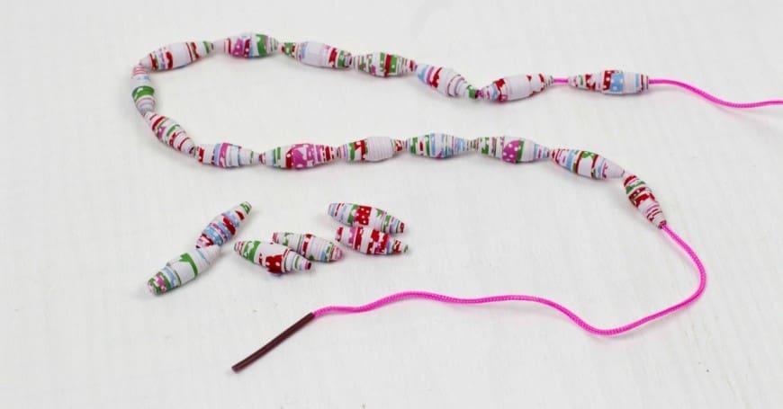 How to make paper beads from wrapping paper. What a fab craft DIY for recycling paper into jewelry. These would make the perfect DIY gift for Mother's Day. I never realised it was THIS simple!