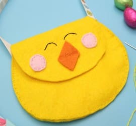 This cute felt chick purse is the perfect introduction in to sewing. A simple DIY craft sewing project to hold your kids Easter eggs this Spring.