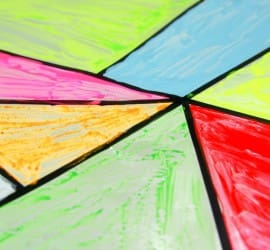 A fabulous faux stained glass art activity for children. This is a fun and simple process art activity that is great for tweens and teens. With a fab tip for making sure the paint doesn't flake and for keeping clean up simple and easy.