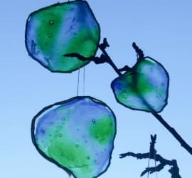 You will never guess what this beautiful stained glass Earth craft is made from. It is a fab fun kids craft perfect for celebrating Earth Day