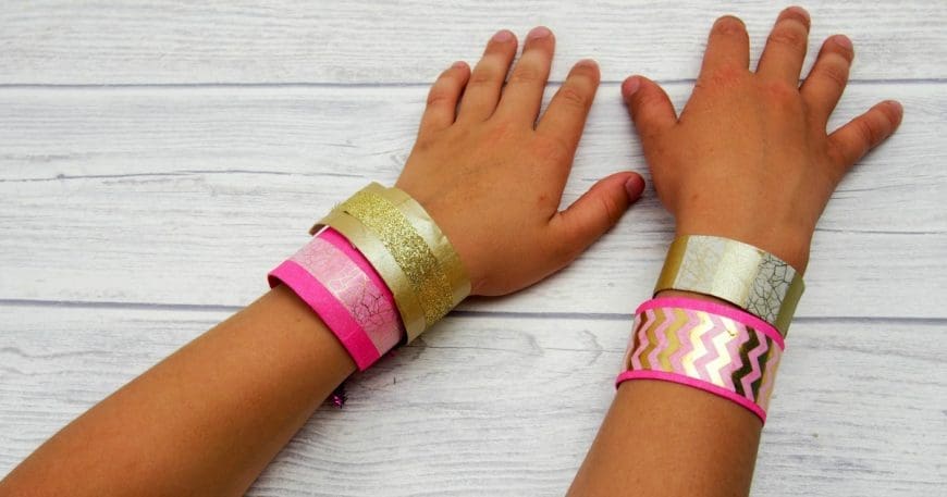 Simple Washi Tape Decorated Toilet Roll Bracelets or Cuffs are a great kids craft perfect for up cycling cardboard tubes and so easy to make. These are just about the cutest, simplest TP roll craft for kids. 