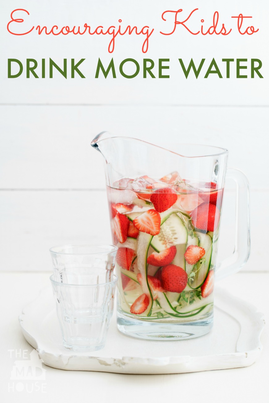 Infused water with cucumber, strawberries and thyme in a pitcher