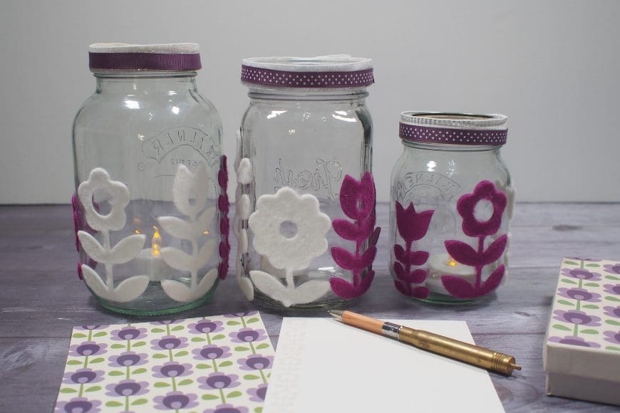 Folk Flower Mason Jar Luminaries a really simple effective craft perfect for upcycling old jars, These folk flower mason jar lanterns have a real mid-century feel.
