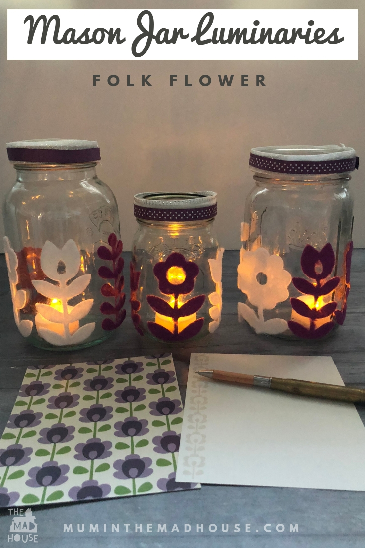Folk Flower Mason Jar Luminaries a really simple effective craft perfect for upcycling old jars, These folk flower mason jar lanterns have a real mid-century feel.