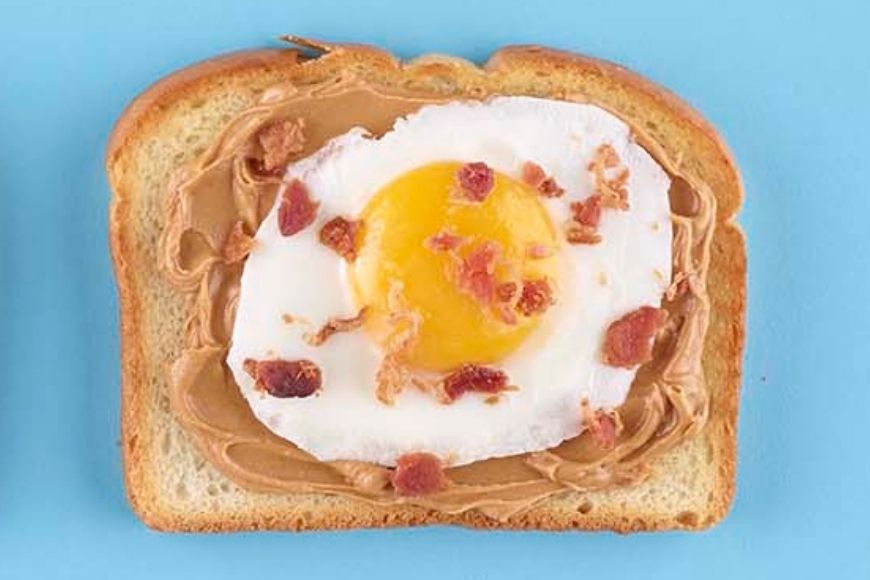 Fried egg and bacon on Toast with peanut butter